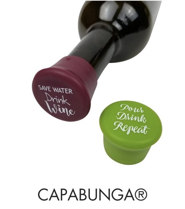 One burgundy bottle stopper from CapaBunga on a wine bottle reads "Save Water, Drink Wine," and another separate green stopper displays "Pour, Drink, Repeat.