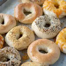 A tray of different types of bagels.