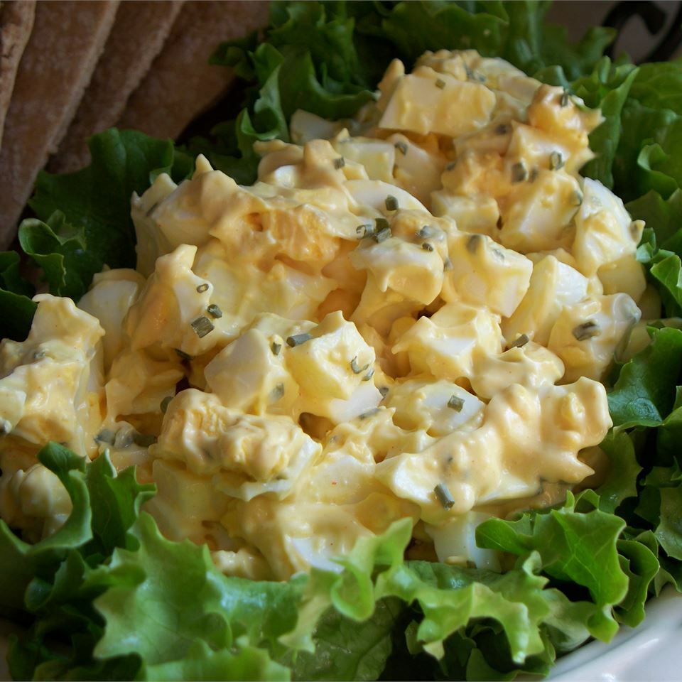 A plate of food that is on some lettuce.