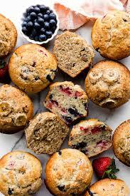 A bunch of muffins sitting on top of a table.