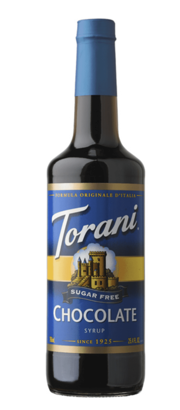 A bottle of torani syrup with a castle on it.