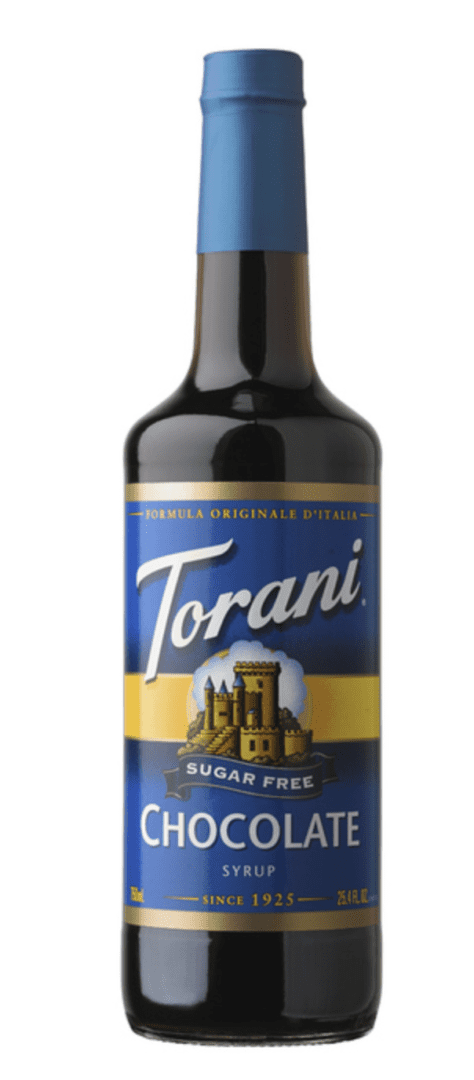 A bottle of torani syrup with a castle on it.
