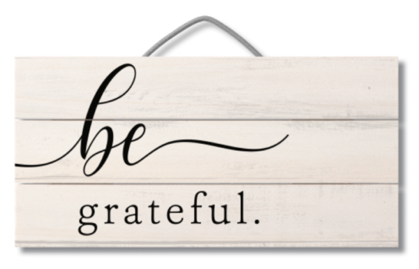 A sign that says be grateful.