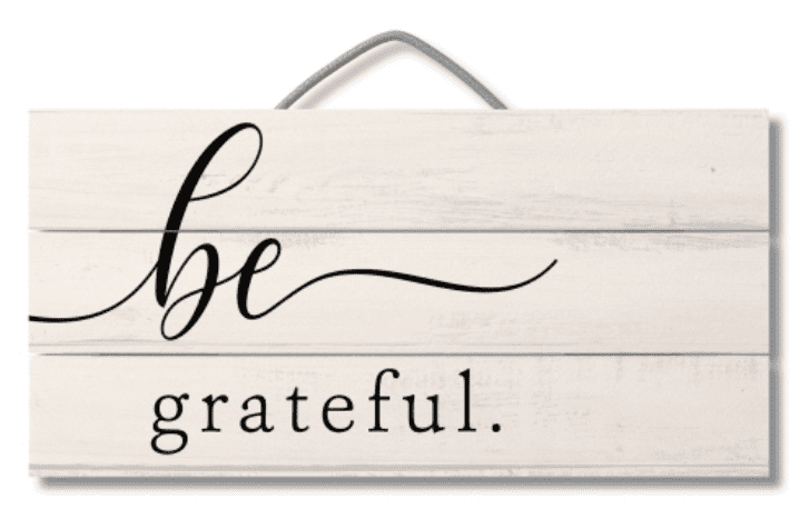 A sign that says be grateful.