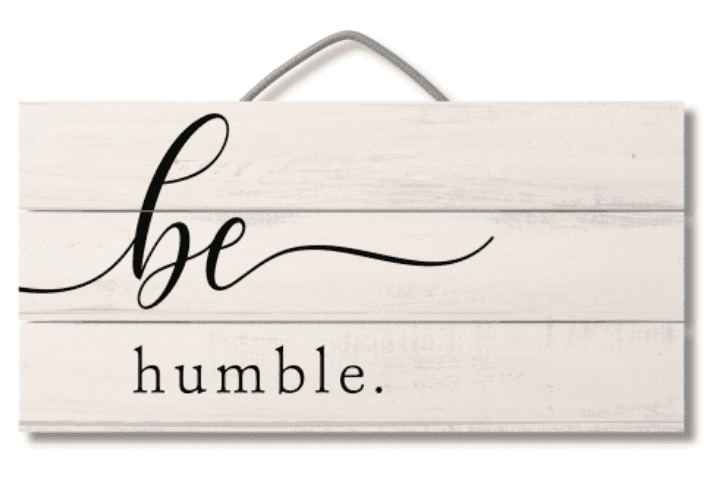 A sign that says be humble.