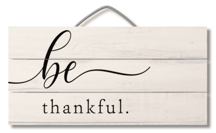 A sign that says be thankful.