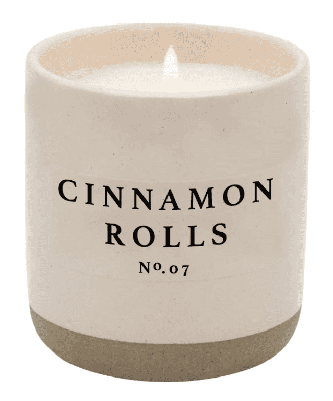 A candle that is sitting in the middle of a table.