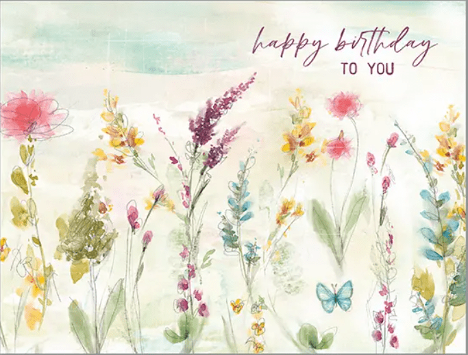 A birthday card with flowers and butterflies