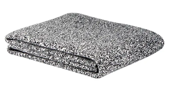 A folded blanket that is black and white