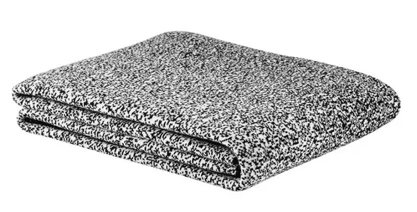 A folded blanket that is black and white