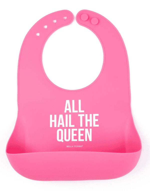 A pink bib with the words " all hail the queen ".