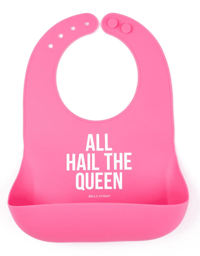 A pink bib with the words " all hail the queen ".