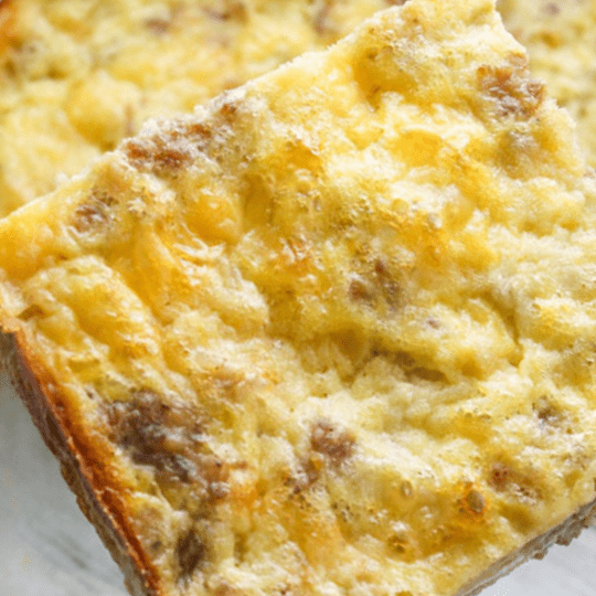 A close up of a piece of food with cheese