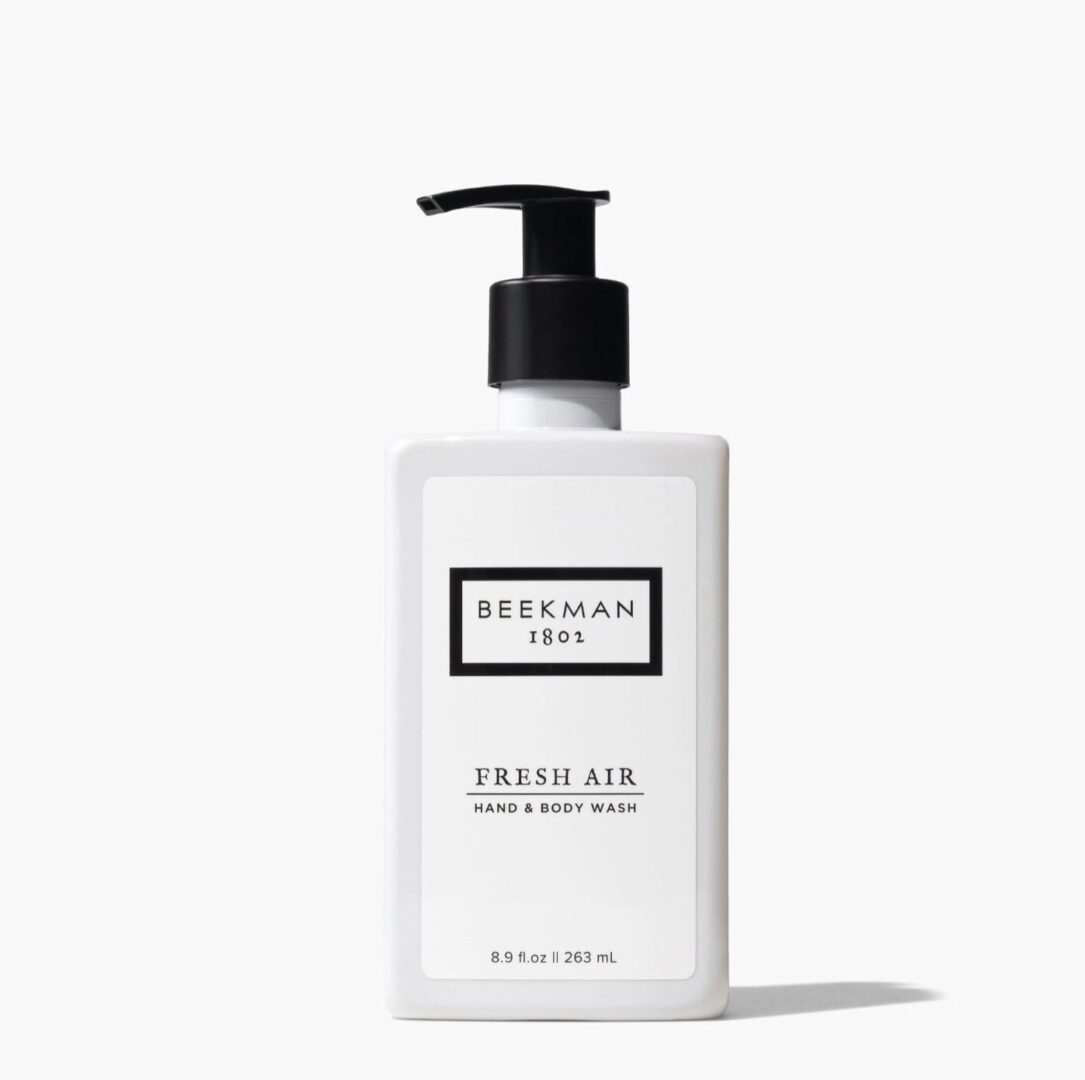 A bottle of hand lotion sitting on top of a table.