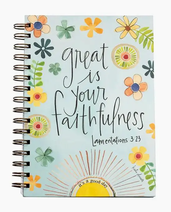 A spiral bound notebook with the words great is your faithfulness.