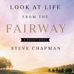 A book cover with trees and mountains in the background.