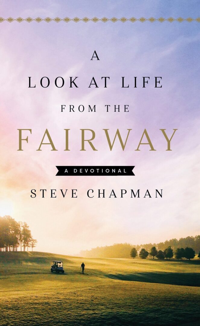 A book cover with trees and mountains in the background.