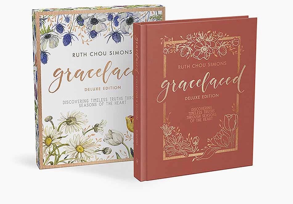 Two books, one of which is a floral design and the other of a red book.