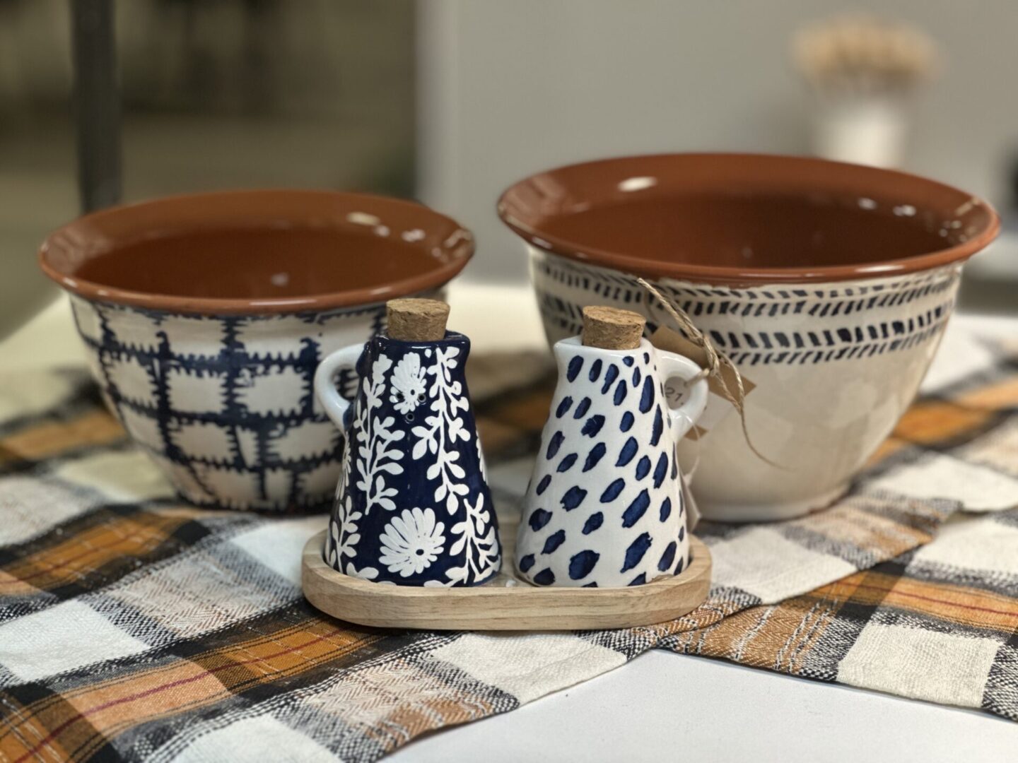 A table with two bowls and a cup on it