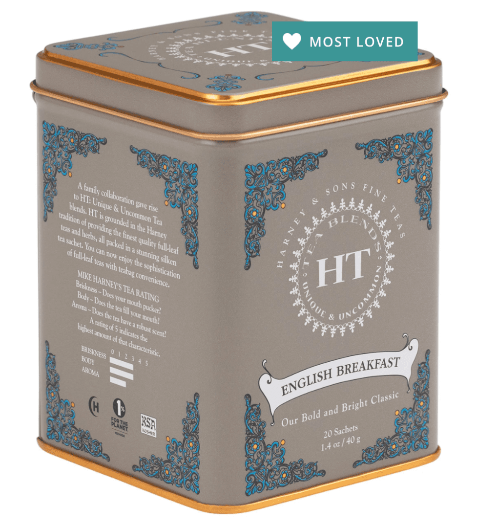 A square tin of Harney & Sons English Breakfast tea with ornate blue and gold detailing, labeled "Most Loved." Contains 20 sachets, 1.4 oz total.