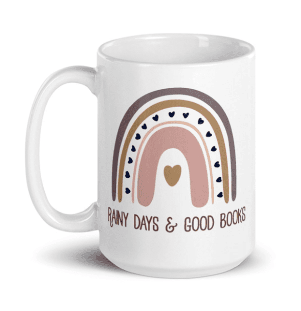 White mug with a rainbow design and the text "Rainy Days & Good Books.