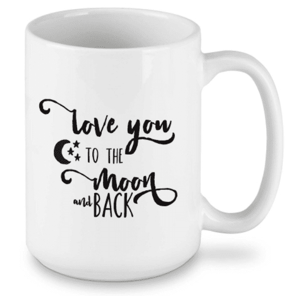 White mug with black cursive text: "Love you to the moon and back," featuring a crescent moon and stars.