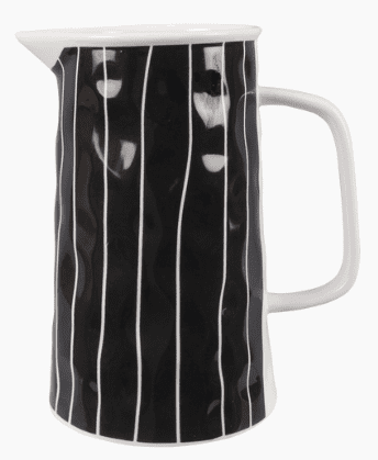 A black ceramic pitcher with vertical white stripes and a white handle.