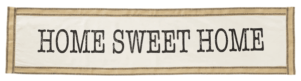 A fabric banner with the text "HOME SWEET HOME" in bold, black letters on a white background with a tan border.