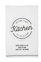 White kitchen towel with black text: "Welcome to our kitchen," and a list: "Cereal served all day, closed at night, momma say it ere starving.
