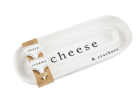 White oblong plate labeled "cheese & crackers" with two small cheese markers reading "sharp" and "creamy," attached to cardboard.