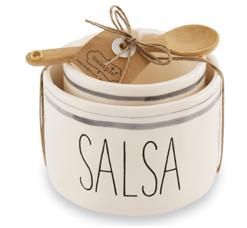 White ceramic salsa bowl with "SALSA" written on it, accompanied by a small wooden spoon tied with twine and a tag.