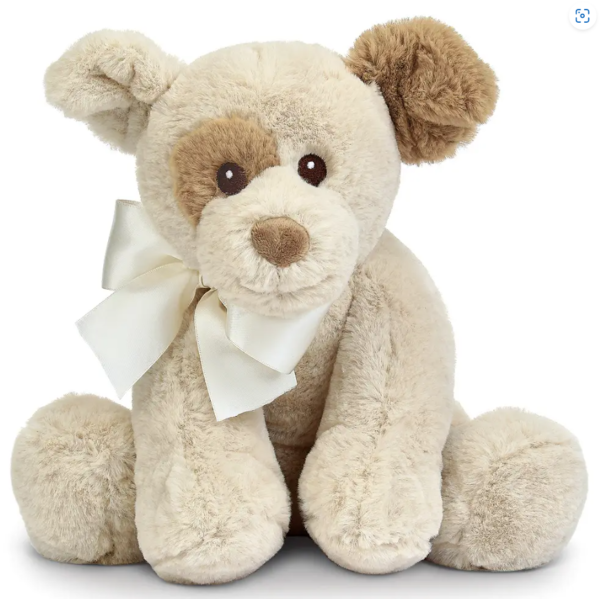 A beige plush teddy bear with a white ribbon around its neck, featuring light brown patches around one eye and ear, sitting upright.