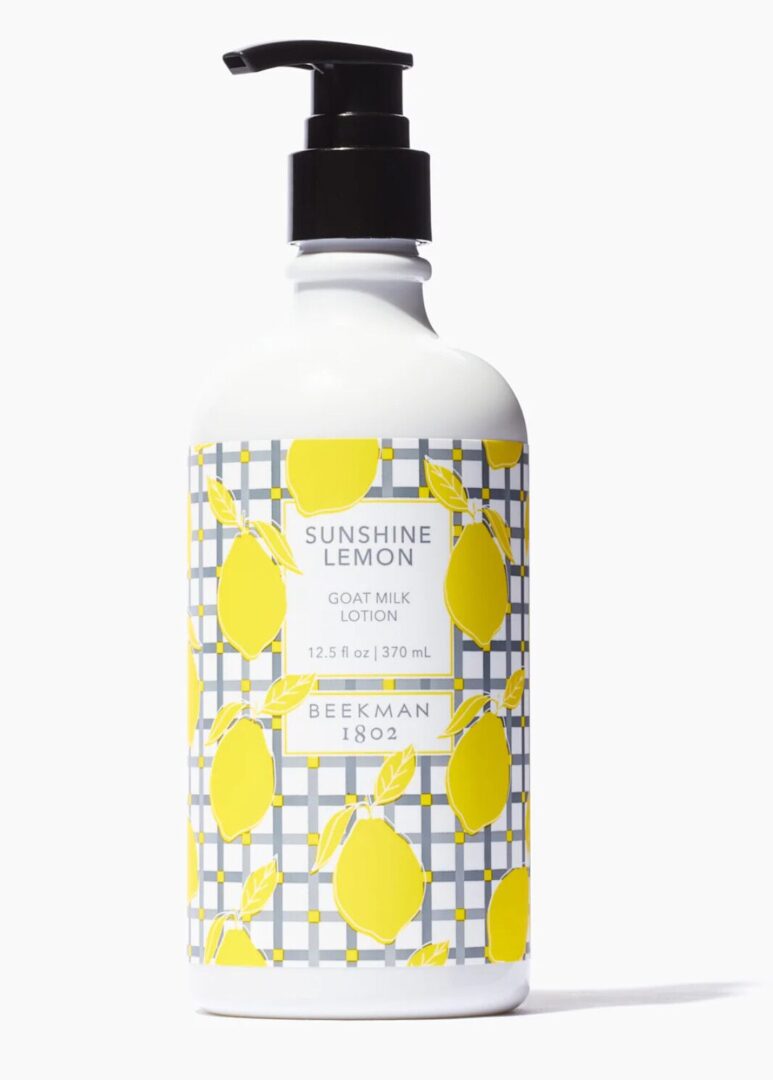 Lotion bottle with a lemon-themed design, labeled "Sunshine Lemon Goat Milk Lotion," 12.5 fl oz / 370 mL, by Beekman 1802.
