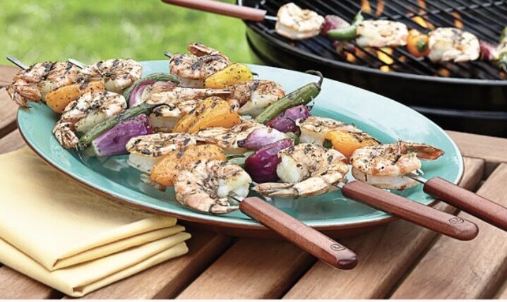 Grilled shrimp and vegetables on skewers.