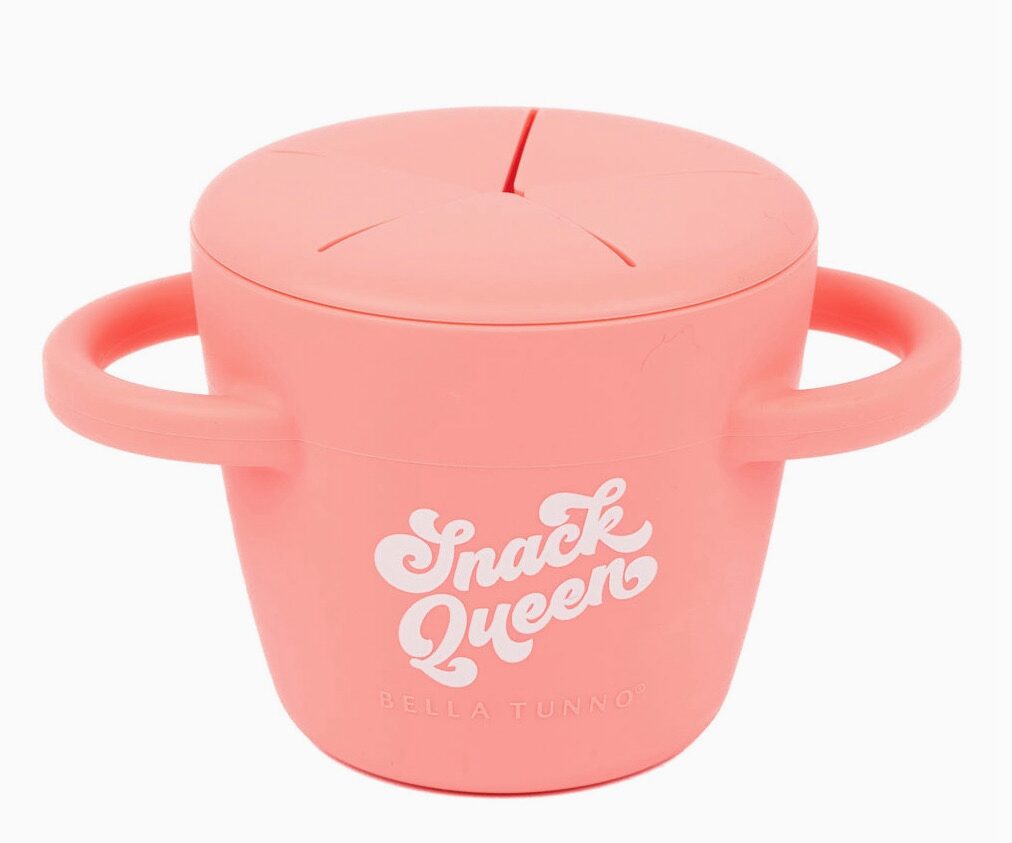 Pink snack container with two handles and a lid featuring the text "Snack Queen Bella Tunno.