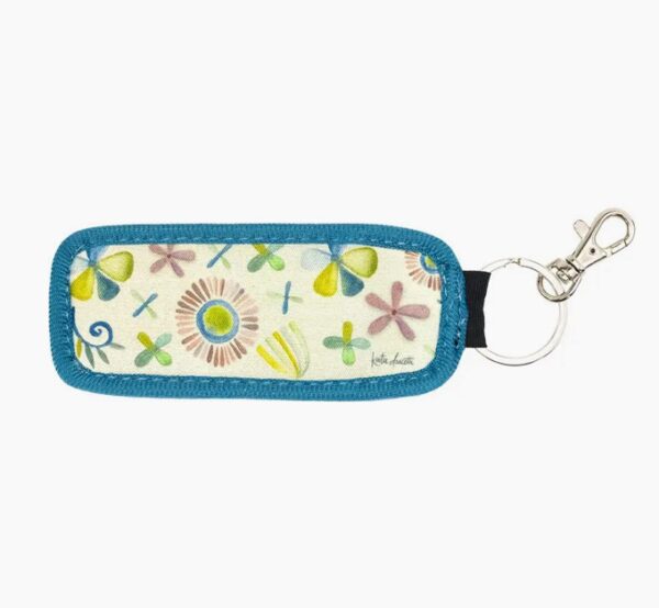Introducing the Blessed Pocket Keychain: a rectangular accessory adorned with a vibrant floral design and accented with blue trim. It conveniently connects to a metal ring and clip.