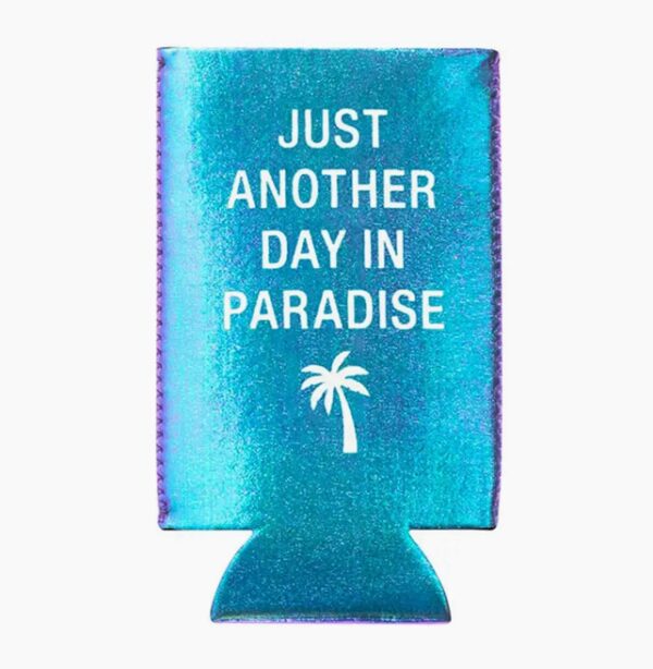 A shiny blue-green drink koozie with white text reading "JUST ANOTHER DAY IN PARADISE" and a palm tree graphic.