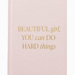 A beige notebook with gold text saying, "Beautiful girl, you can do hard things.