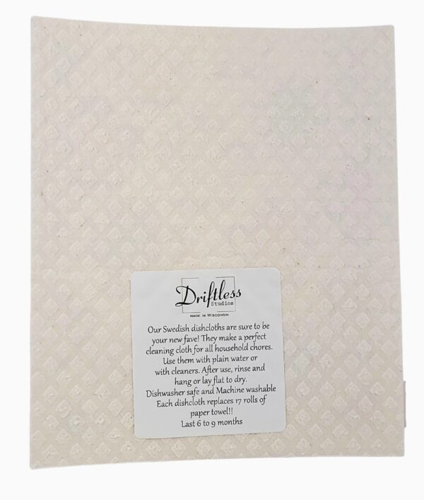 Sunflower Patterned Swedish Dishcloth with a subtle diamond pattern, including a label that provides use and care instructions.