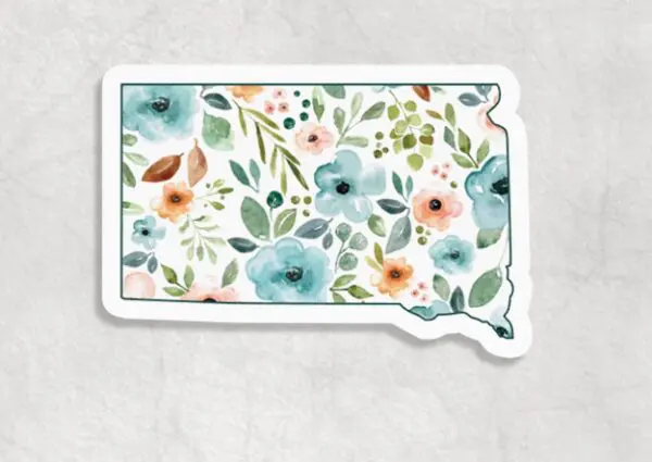 Floral South Dakota Sticker featuring a floral design with blue, pink, and orange flowers on a white background.