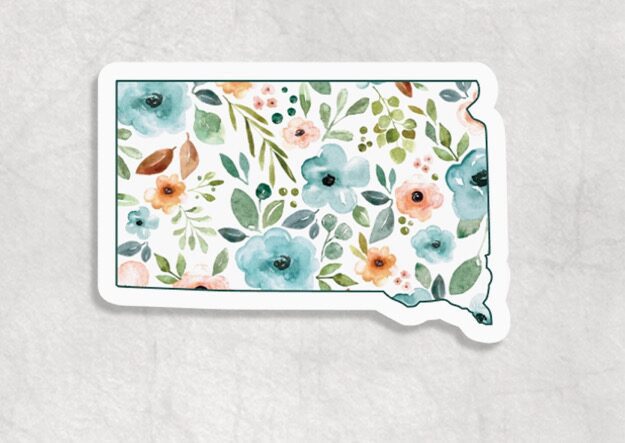 Floral South Dakota Sticker featuring a floral design with blue, pink, and orange flowers on a white background.