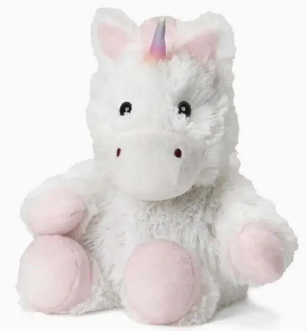 The product is the White Unicorn Warmie - Small, featuring a fluffy white exterior with pink paws and a small rainbow horn, positioned upright against a plain background.