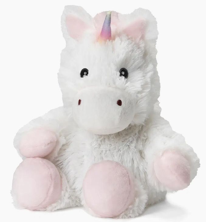 The product is the White Unicorn Warmie - Small, featuring a fluffy white exterior with pink paws and a small rainbow horn, positioned upright against a plain background.