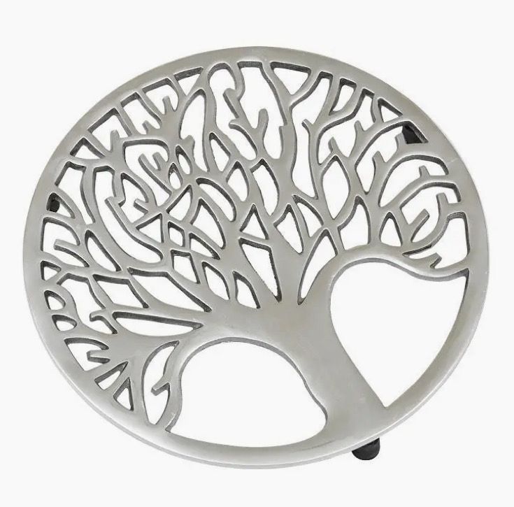 A Tree Trivet with a round, silver design showcasing leafless branches.